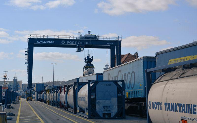 Crane loads train